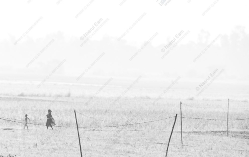 A Woman and Child Through the Hazy Field