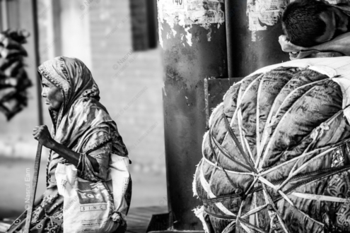 Elderly Woman and Resting Youth by the Roadside