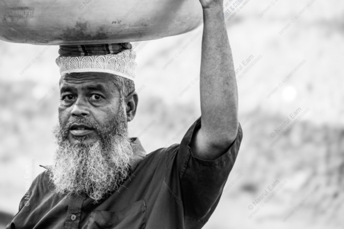 A Laborer Carrying a Bowl