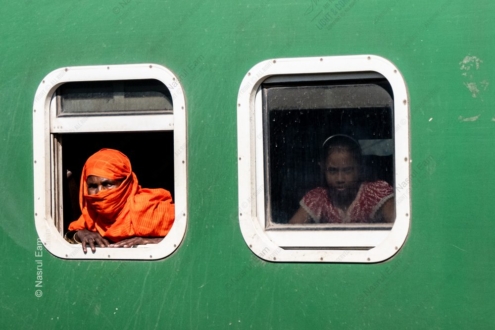 Woman in Orange and Girl in the Window