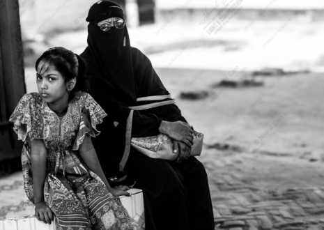A Young Girl and a Veiled Woman