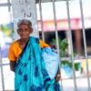 Woman in a Turquoise Sari at the Gate