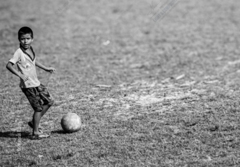 The Boy on the Grass Field