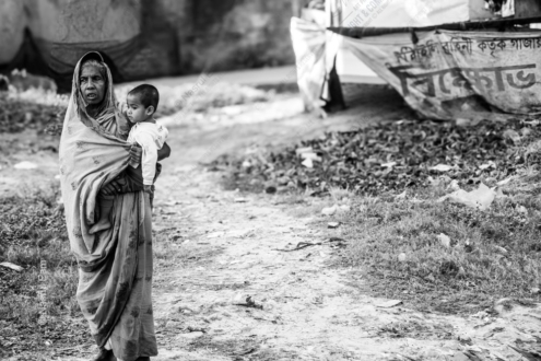 A Grandmother's Embrace on a Village Road